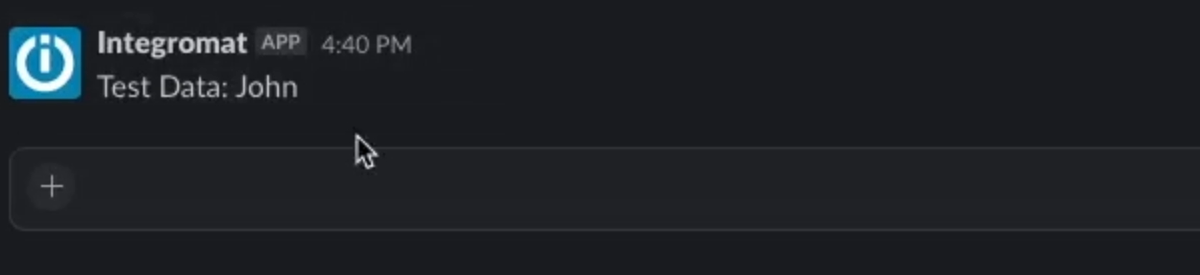 A view of the Slack Message produced by the tested automation in Make displaying the text "Test Data: John"