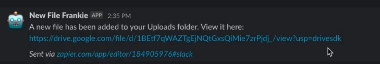 An automatically generated Slack message notifying individuals of a new file uploaded to a folder