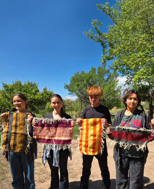 Two adults and three children gardenings
