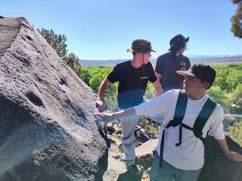 Students studying petroglyphs in New Mexico