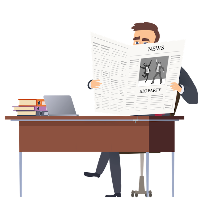 Man at a desk reading a newspaper.