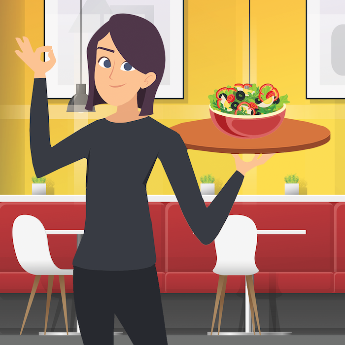An owner of a cafe holding a tray of food