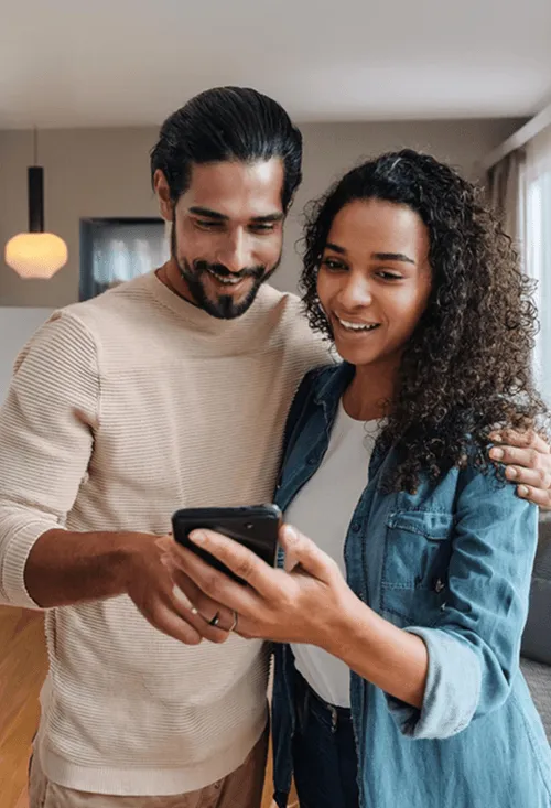 A couple interacting with a mobile phone