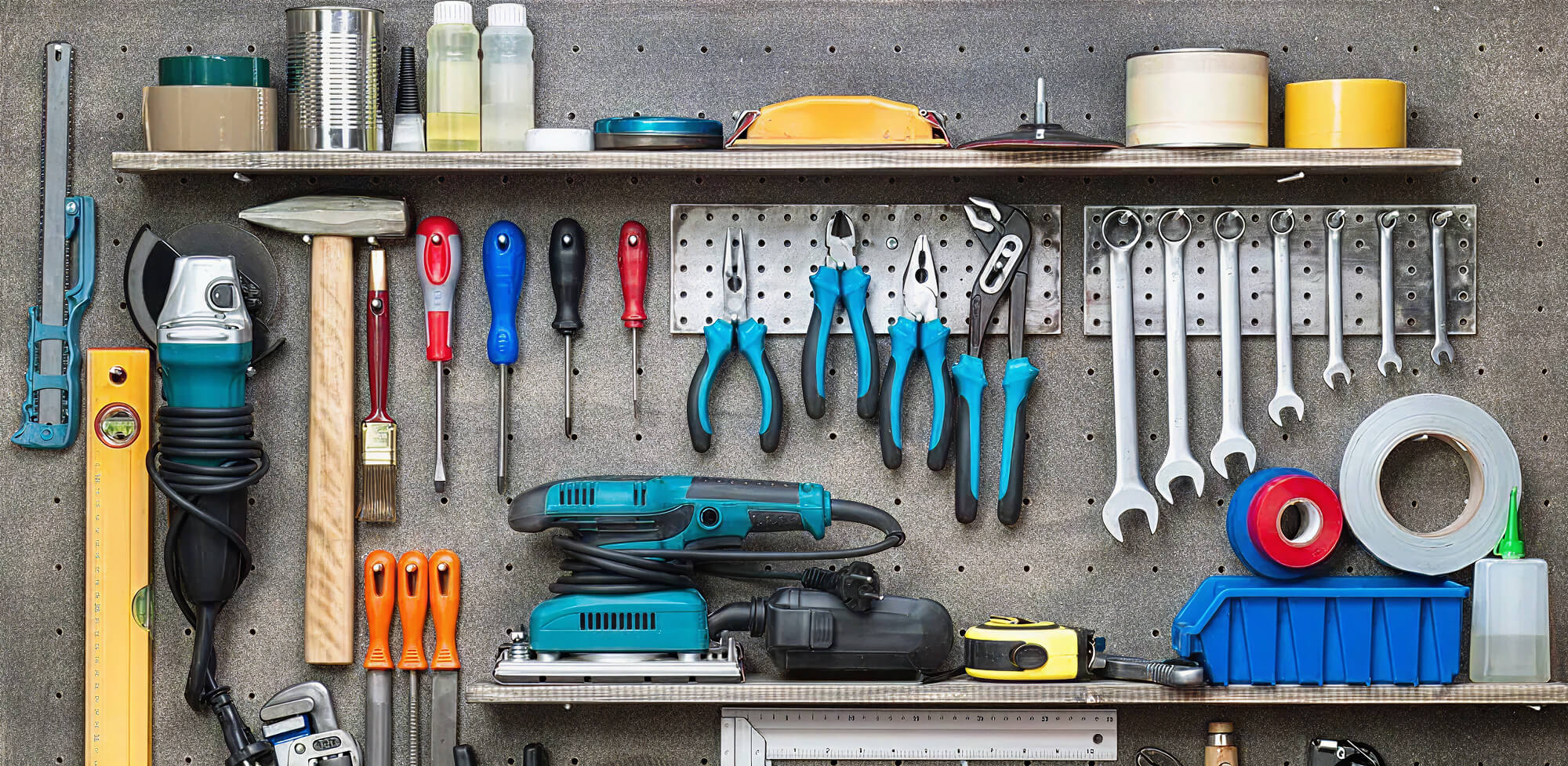 Various tools organized on wall pegboard.