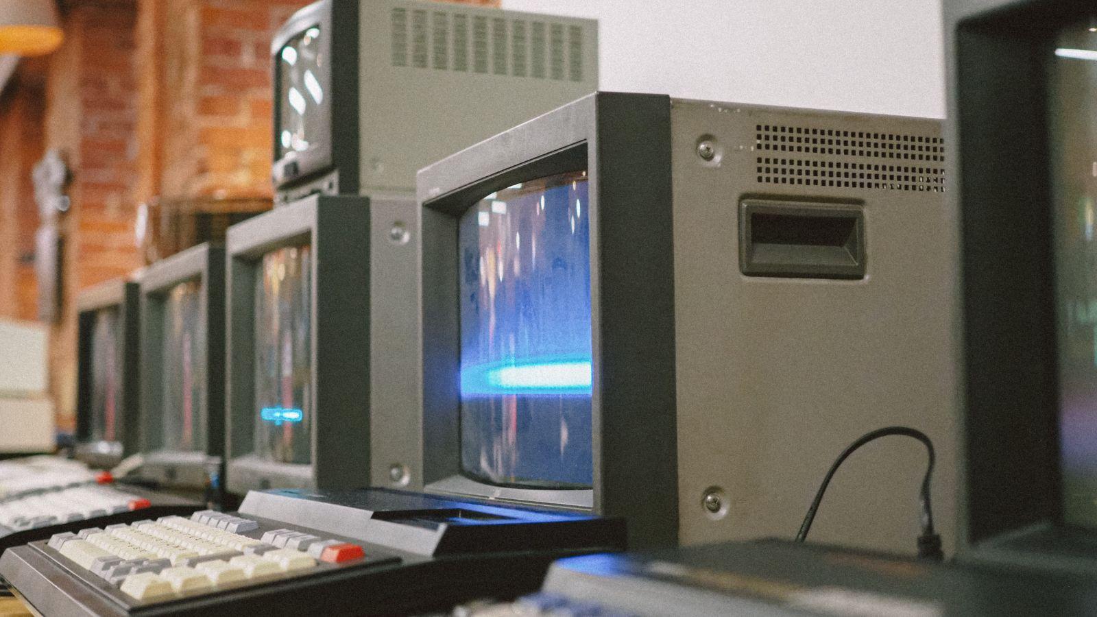 A close-up of several old computer monitorsAI-generated content may be incorrect.