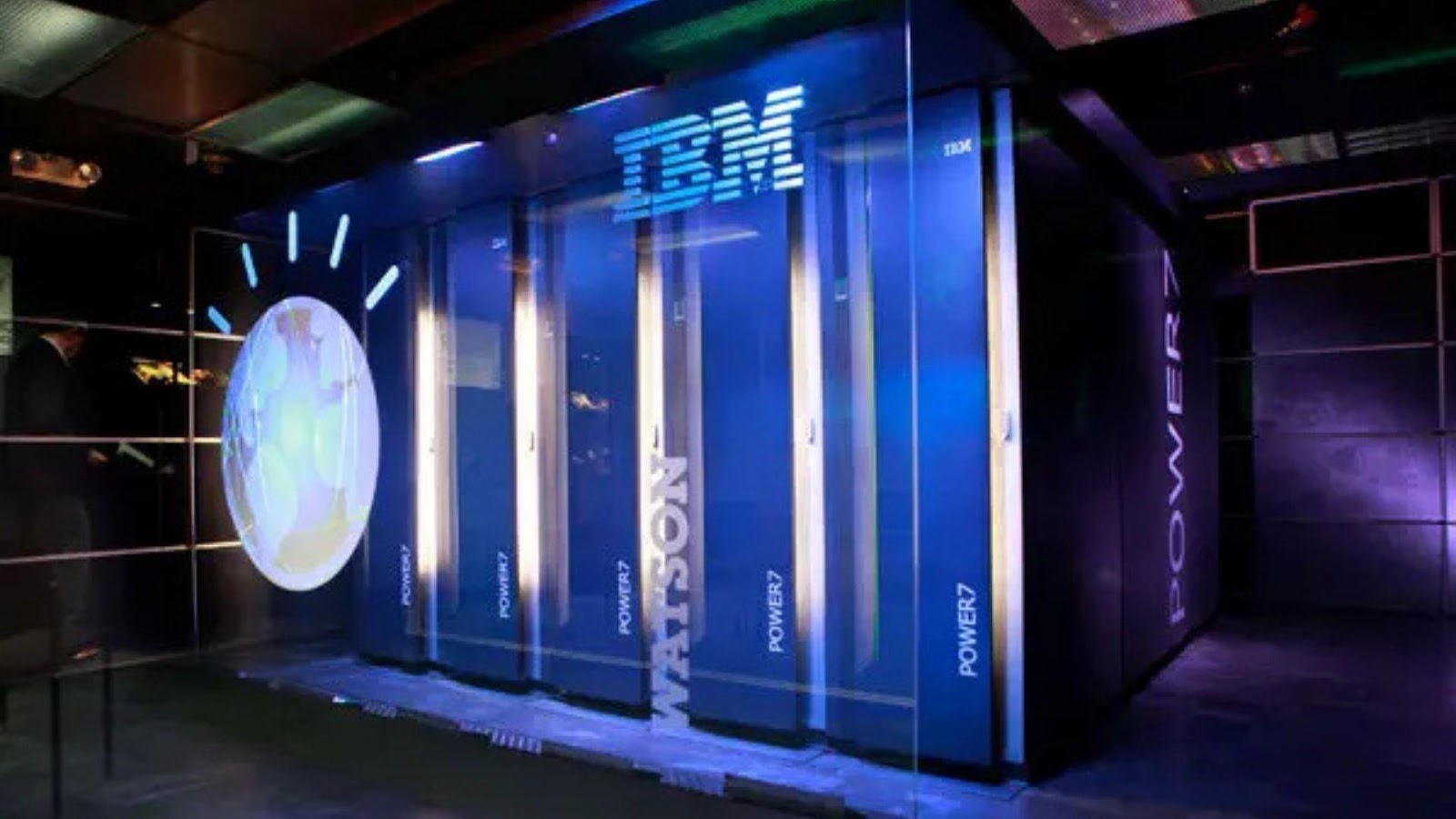 A large glass building with a large clockAI-generated content may be incorrect.