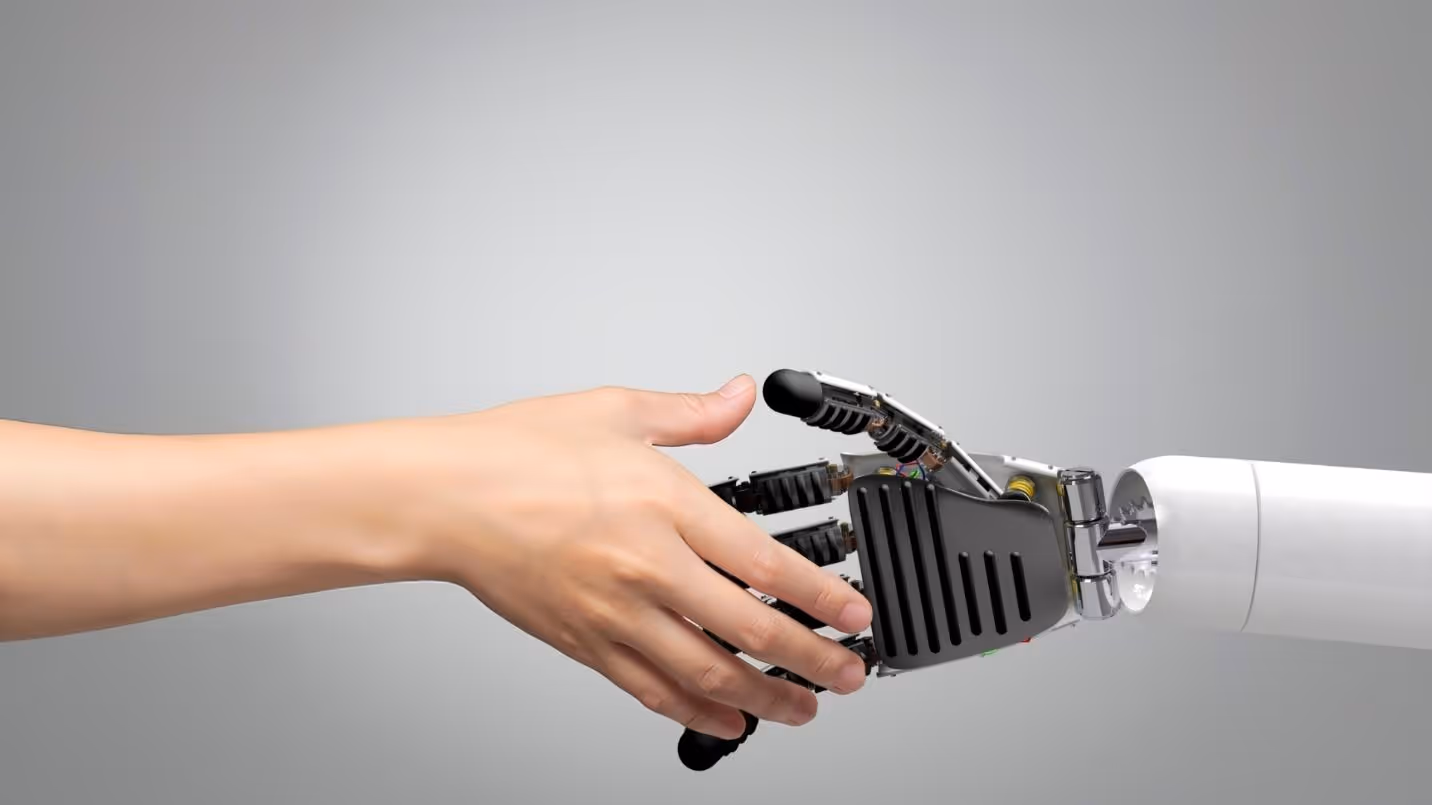 A hand holding a robotAI-generated content may be incorrect.