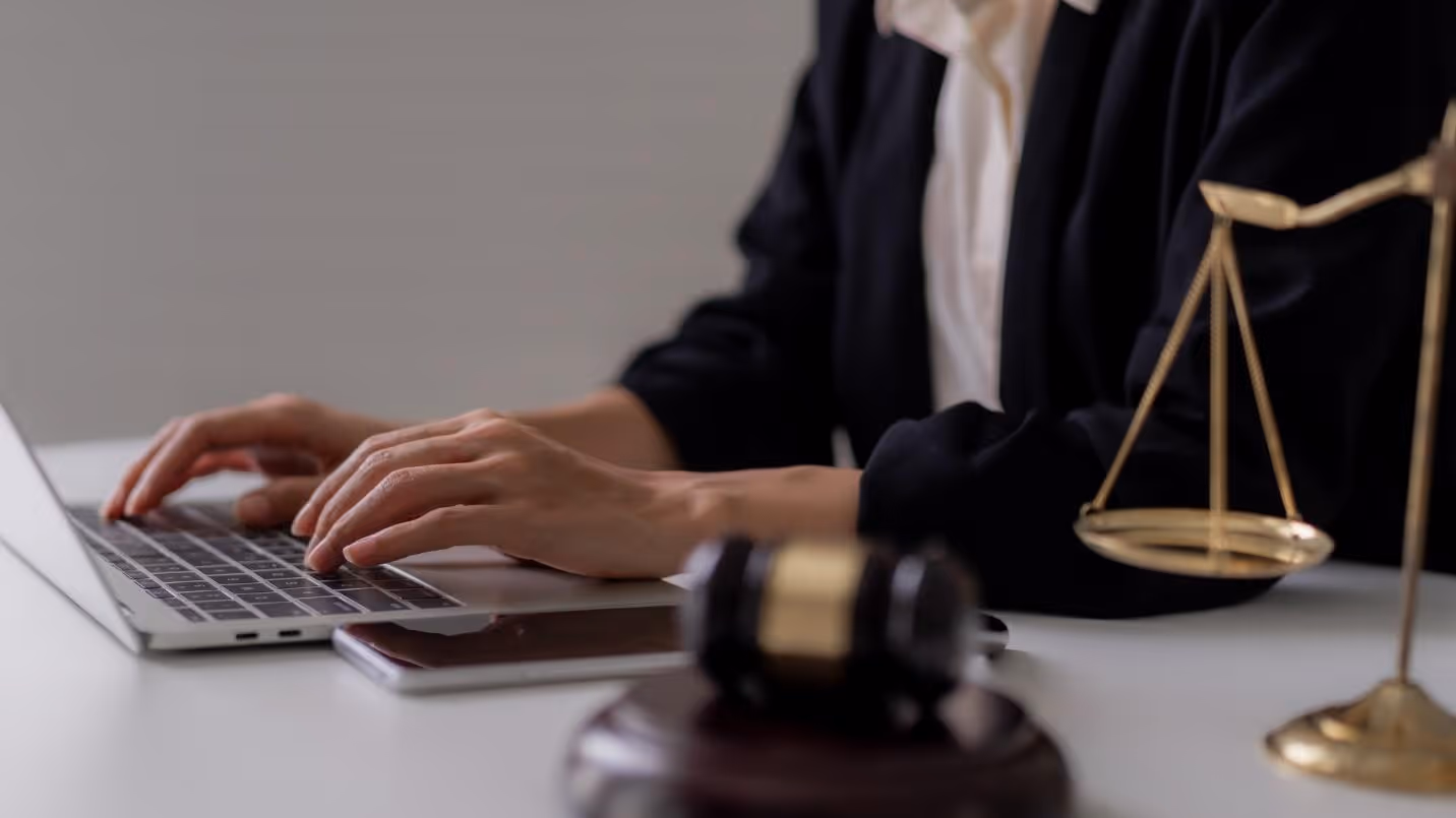 A judge using a computerAI-generated content may be incorrect.