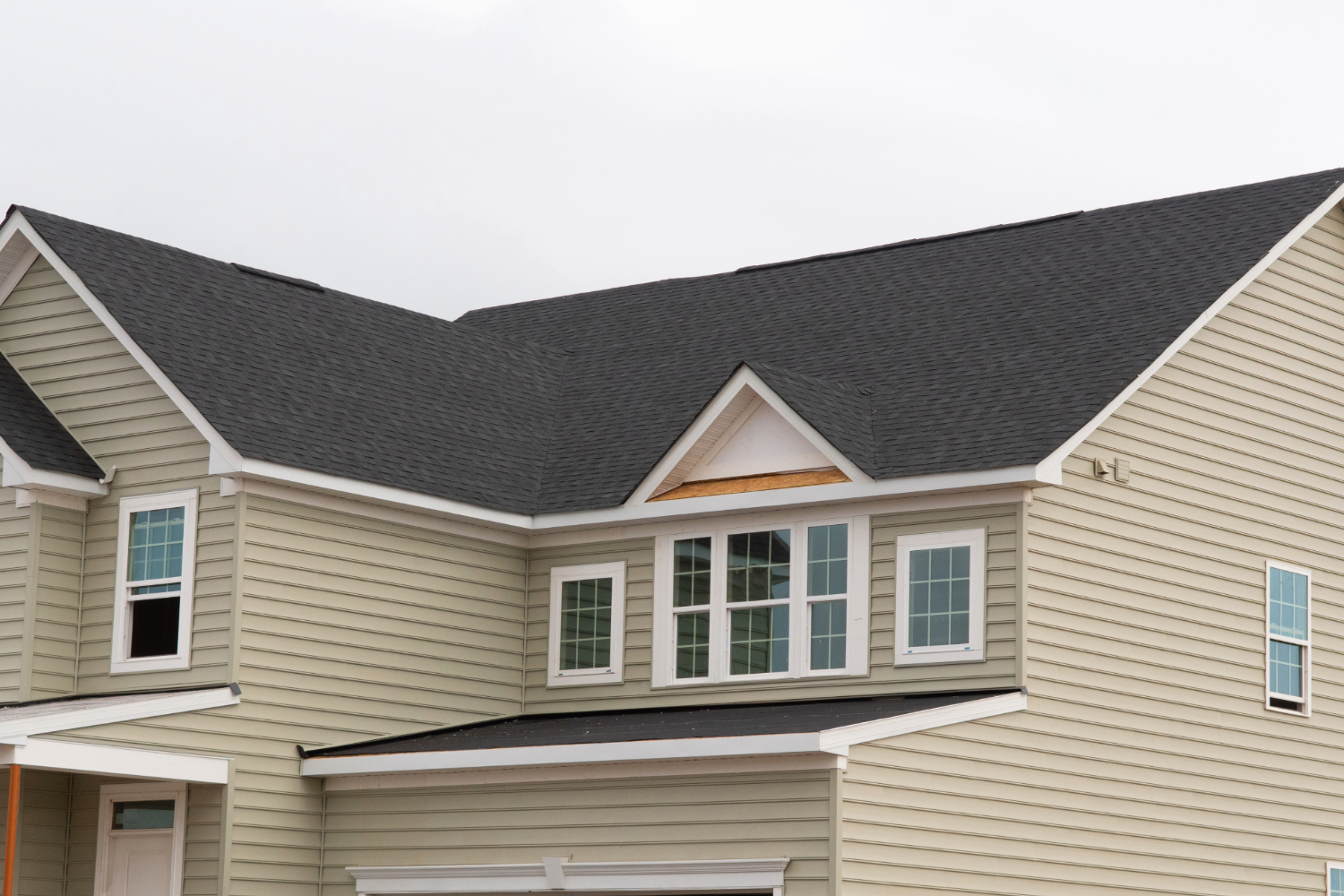 House with newly installed windows and siding.