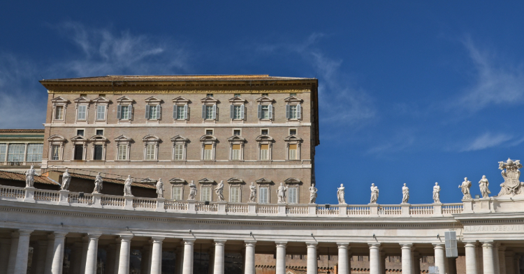 Vatican Apostolic Palace under blue sky.