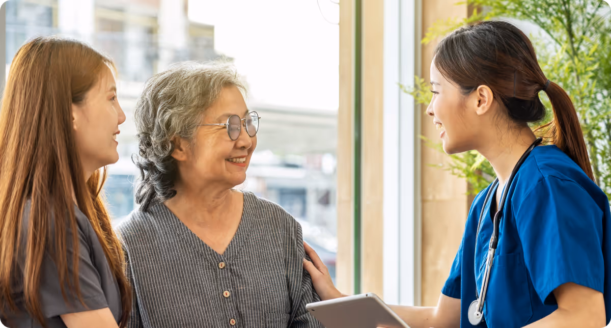 Compassionate medical staff supporting a patient and their family at a pain management clinic