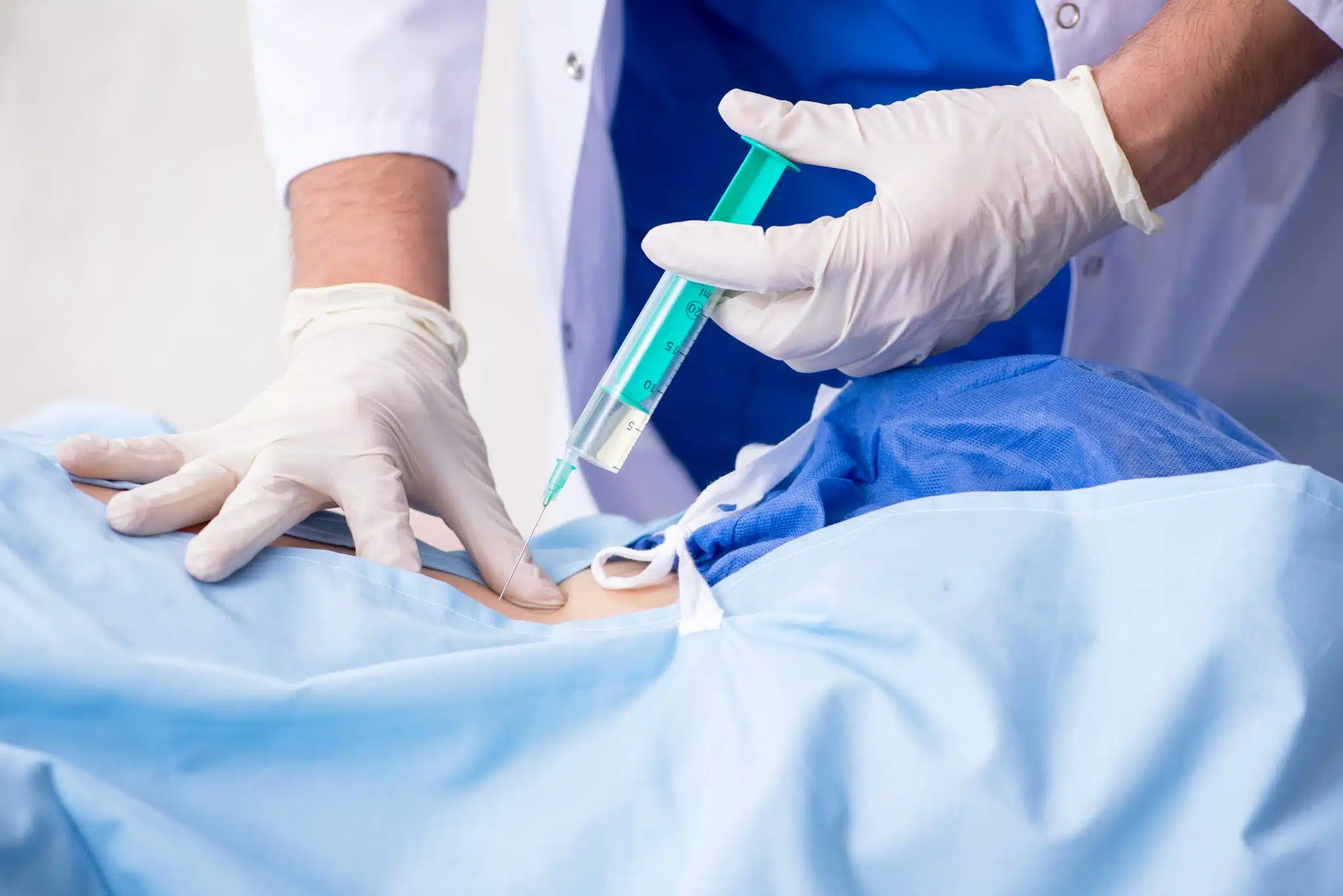 Image showing spinal injection procedure for spinal pain treatment targeting disc, nerve, or facet joint-related pain.