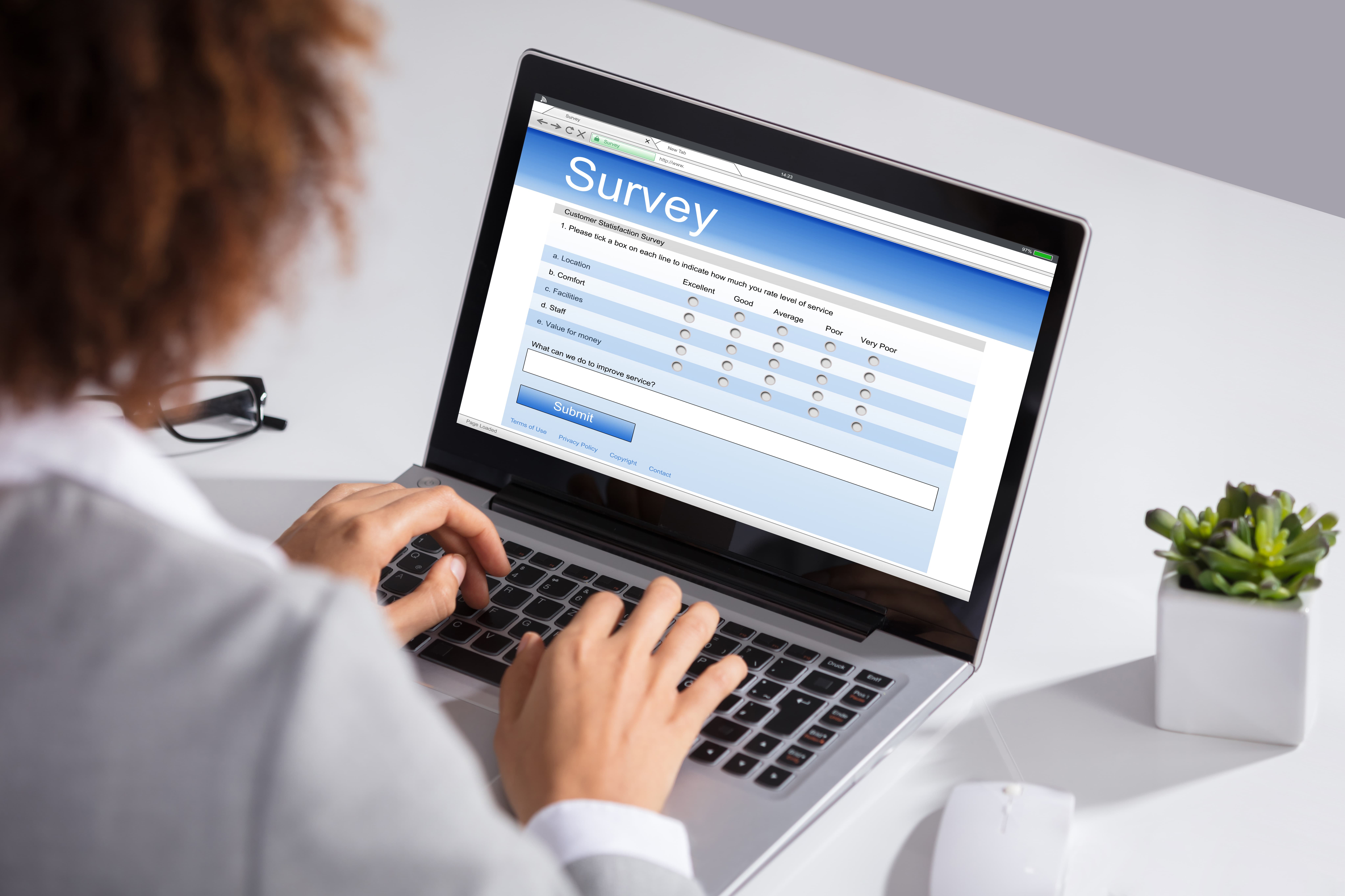 A woman taking an online survey.