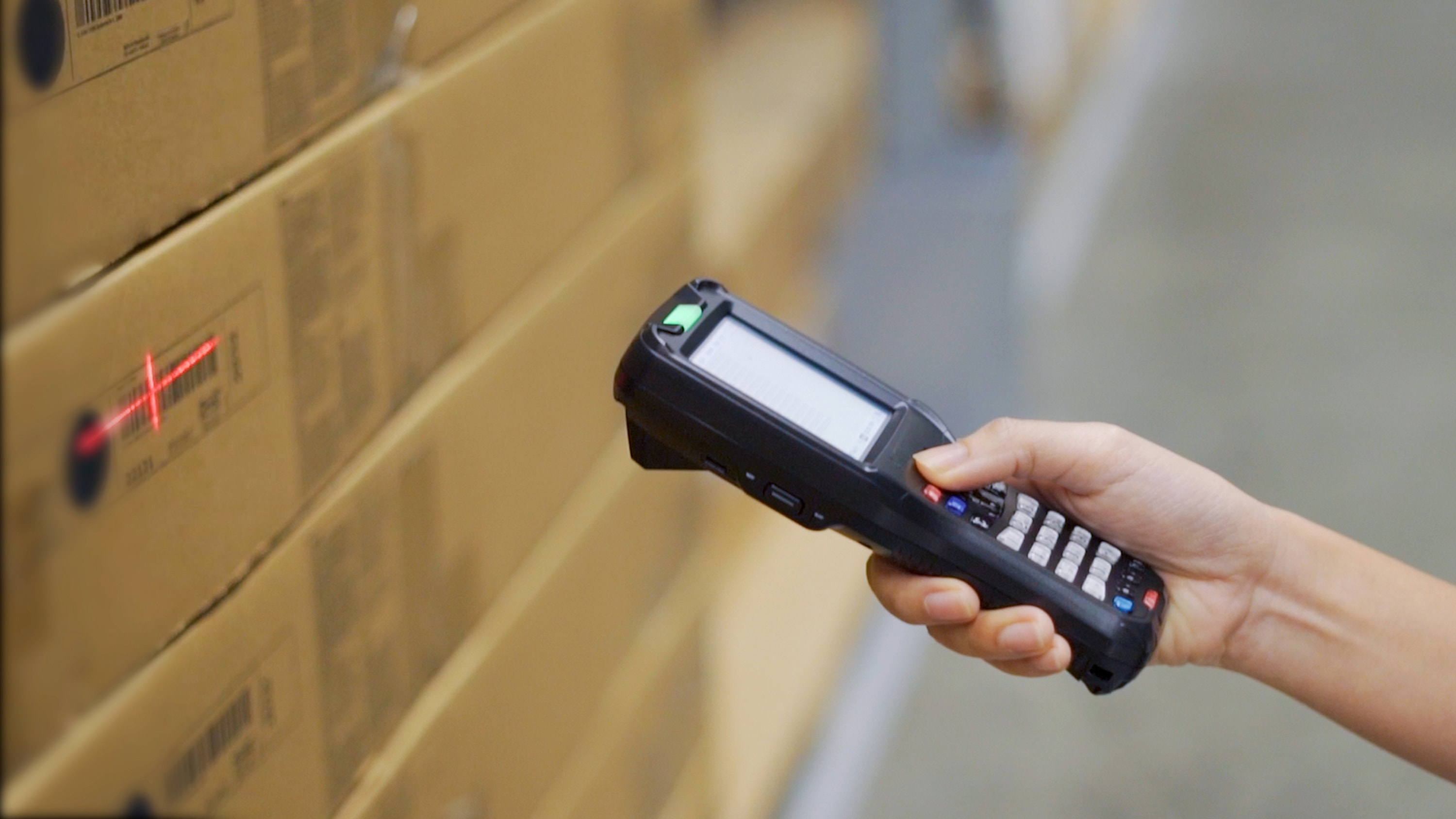 A box in a warehouse being scanned for inventory.