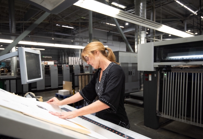 A woman working in a manufacturing facility.