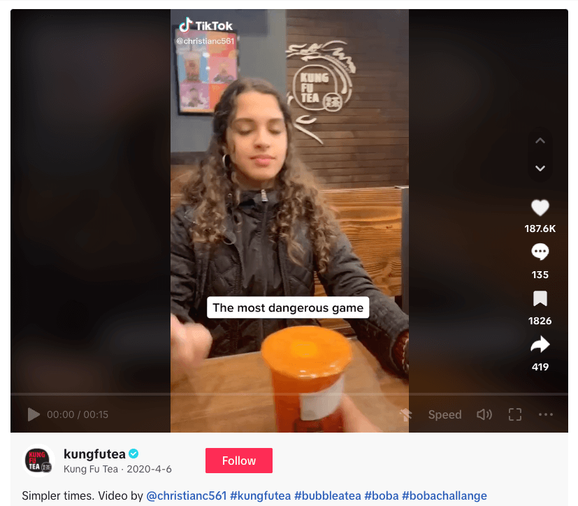 Person with closed eyes next to orange bubble tea drink