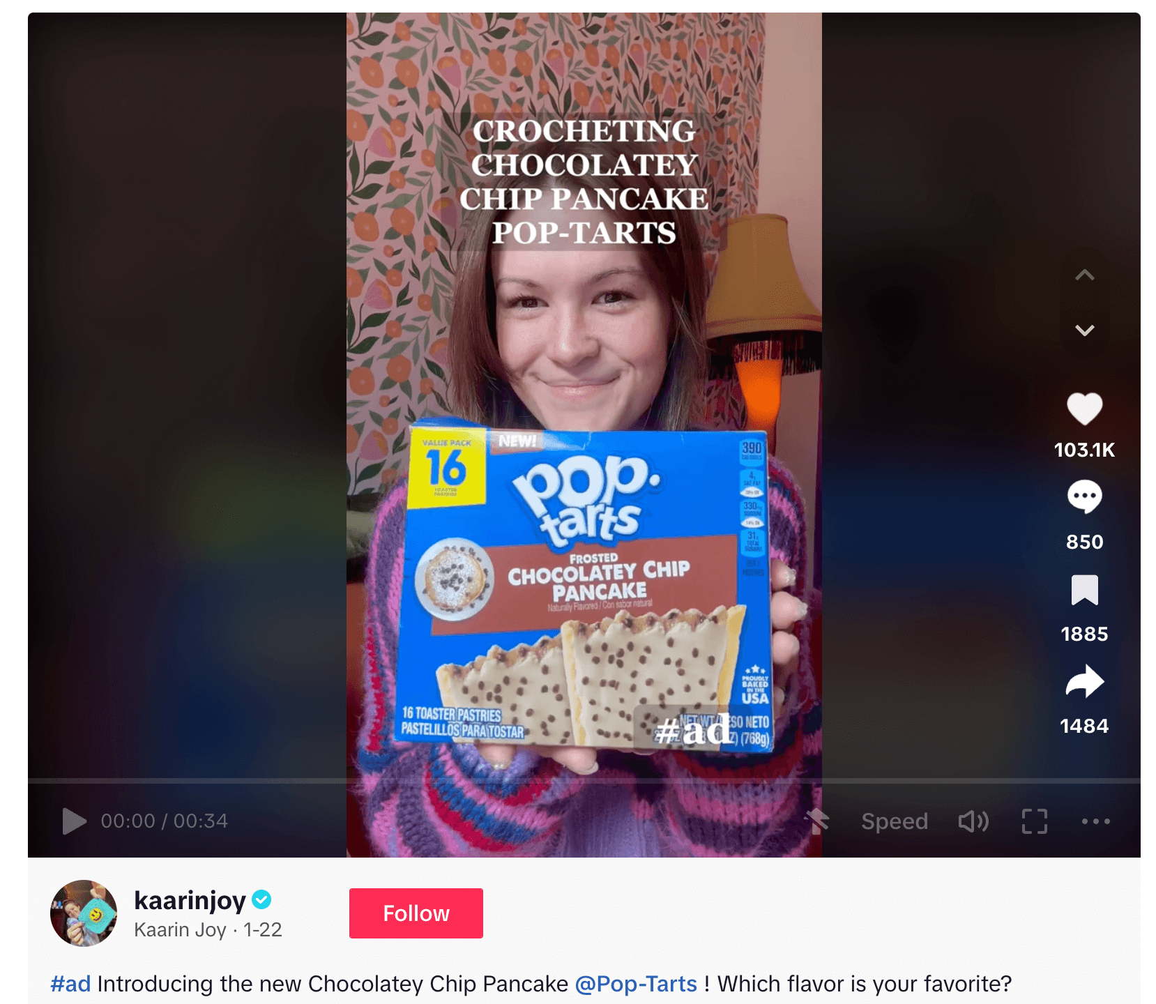 Woman holding Chocolatey Chip Pancake Pop-Tarts box with excited smile