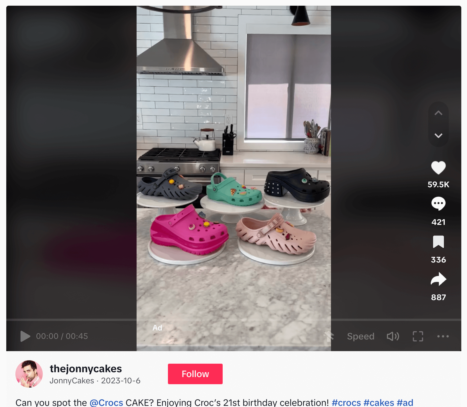 Colorful Crocs shoes displayed on cake stands in a modern kitchen