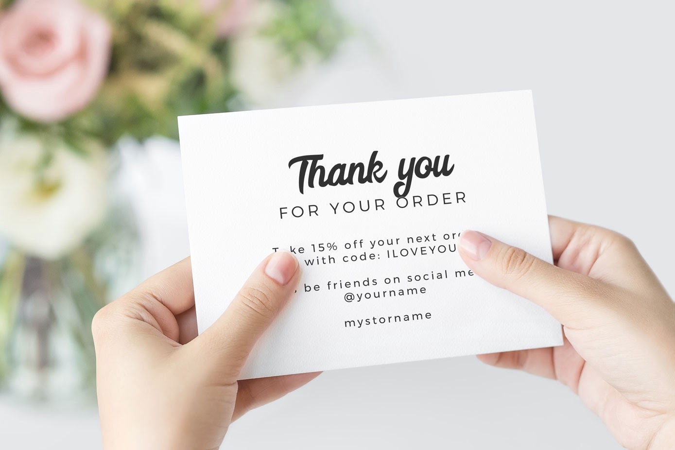 Thank you card with discount offer and blurred floral background