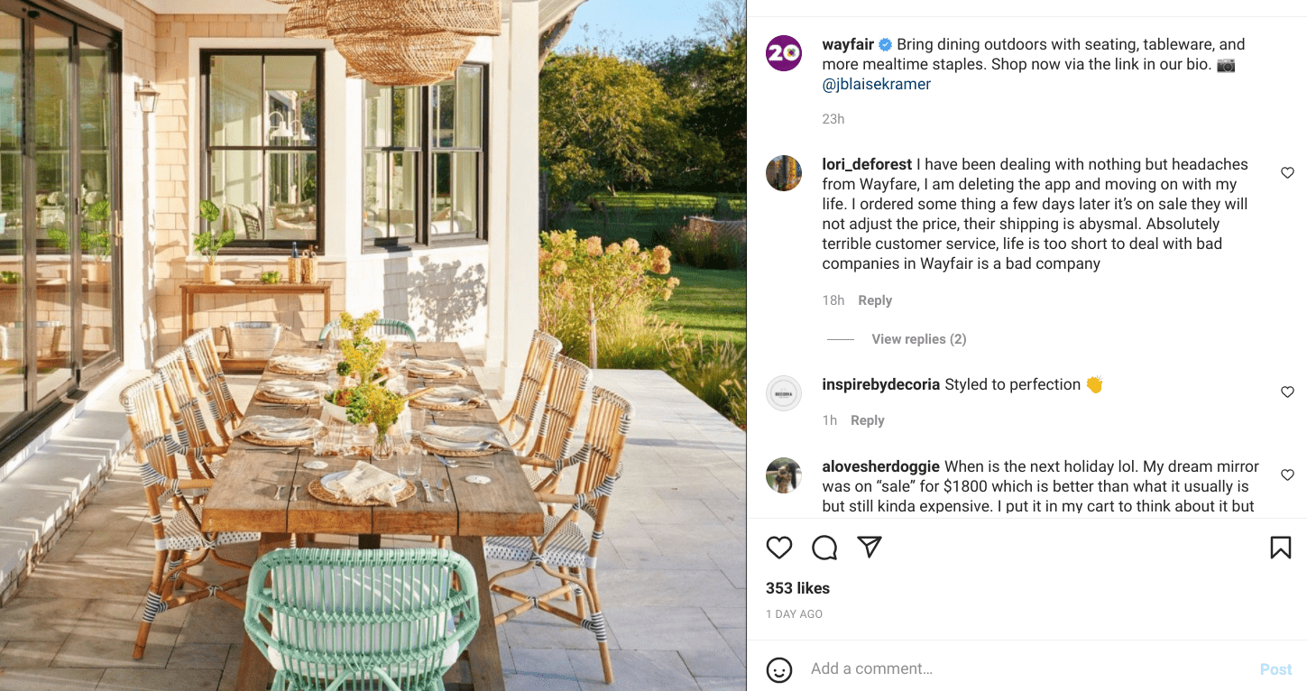 Elegant outdoor dining table set on patio with woven chairs and hydrangeas