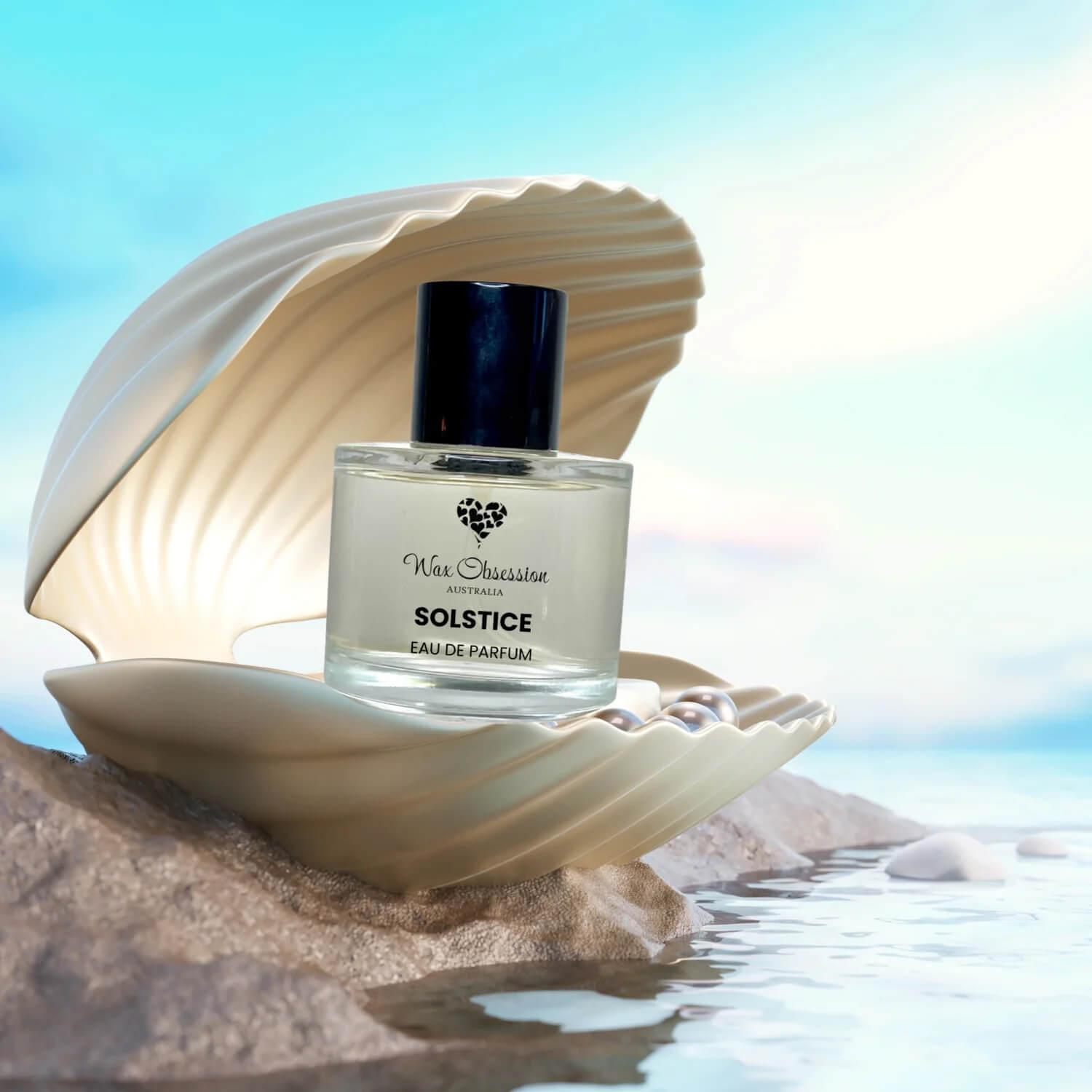 Solstice perfume bottle nestled in a seashell with ocean background