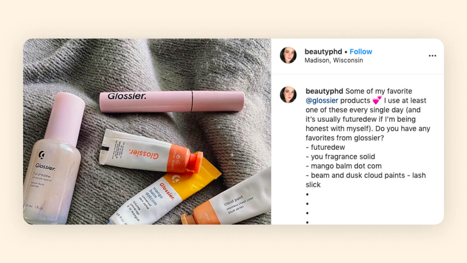 Glossier beauty products in pink, orange, and yellow tubes on gray fabric