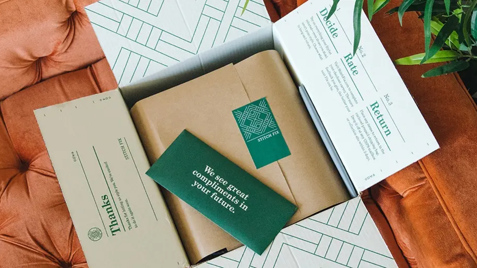 Stitch Fix packaging with green brochure on textured orange background