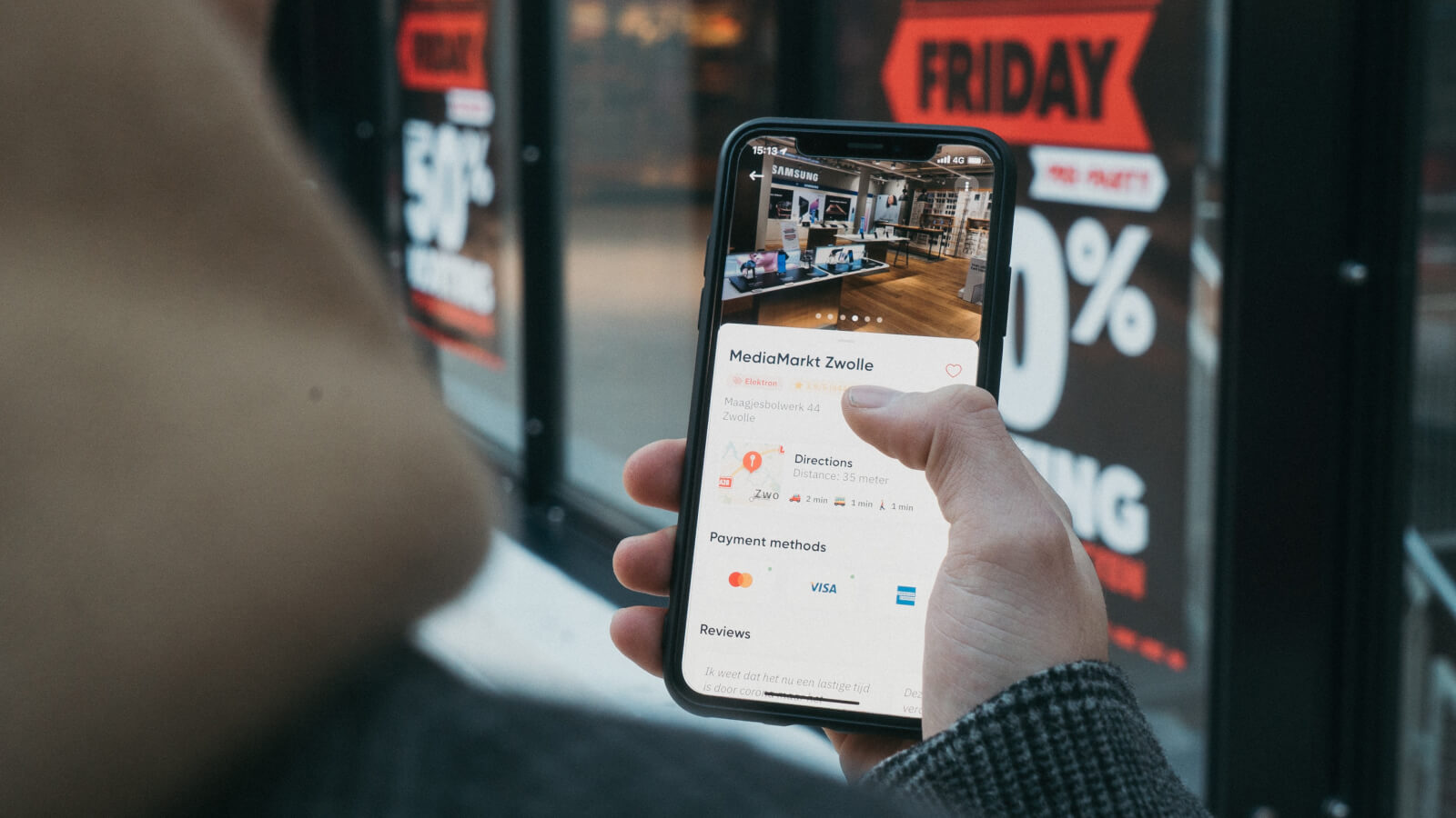 Phone screen showing MediaMarkt Zwolle store details and location