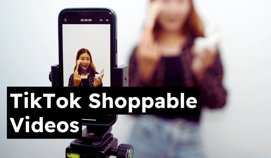 Person recording TikTok video on smartphone with camera mount