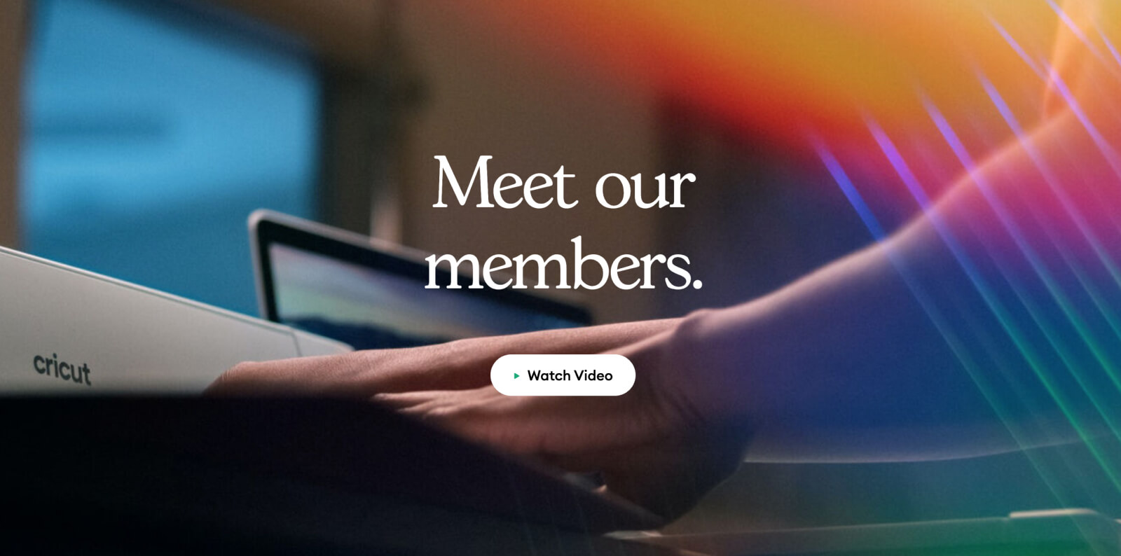 Hand on Cricut keyboard with colorful background, "Meet our members" text
