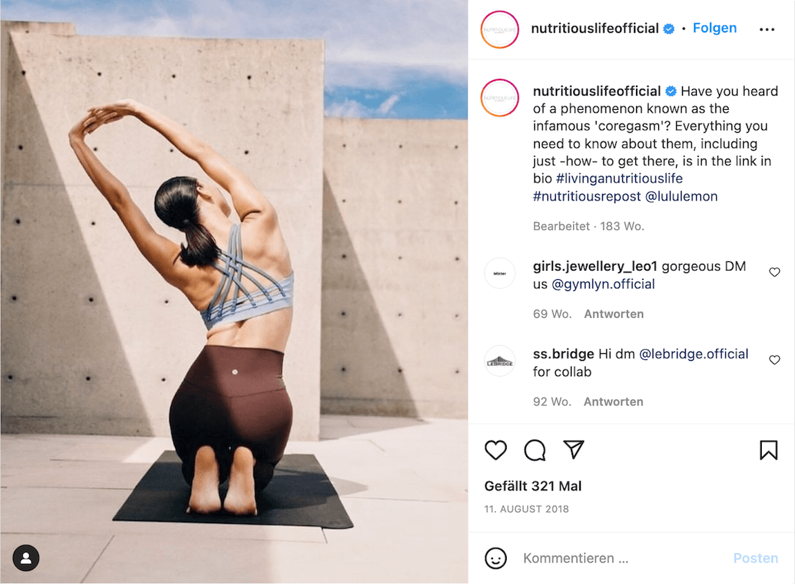 Woman stretching on yoga mat in minimalist concrete space with blue sky
