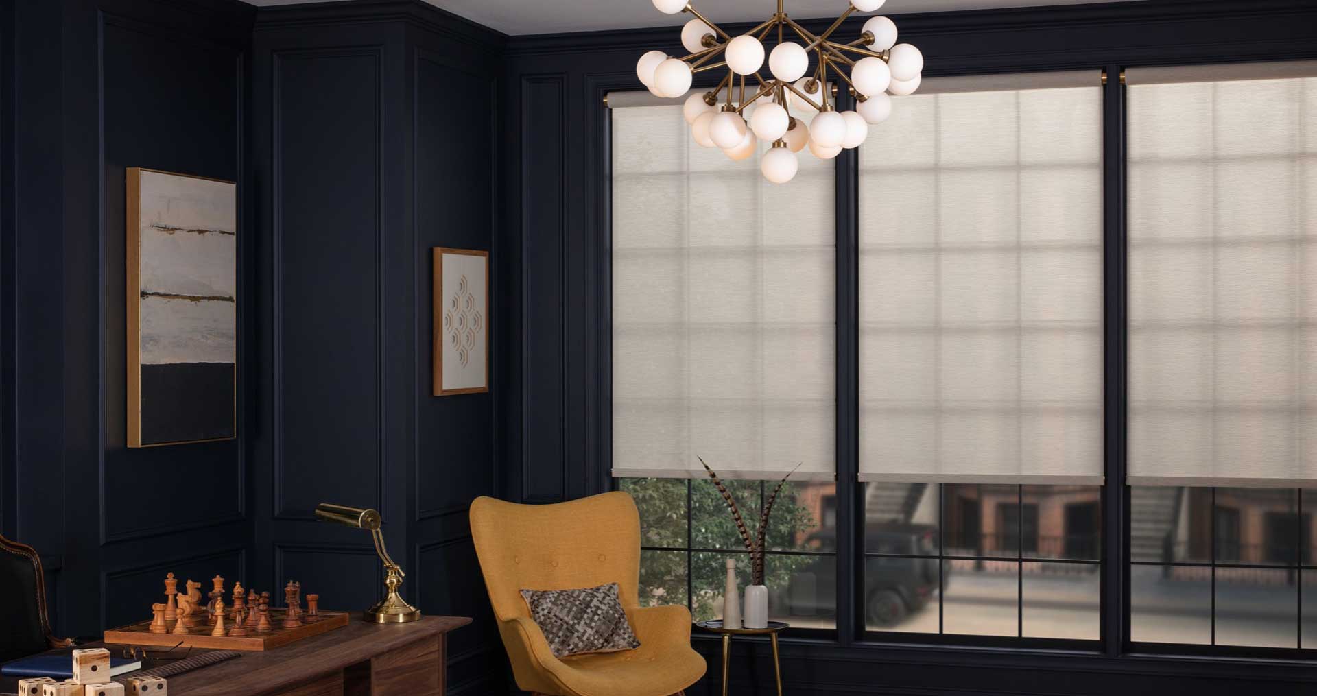 Room with battery-powered window shades, chess set, yellow chair.