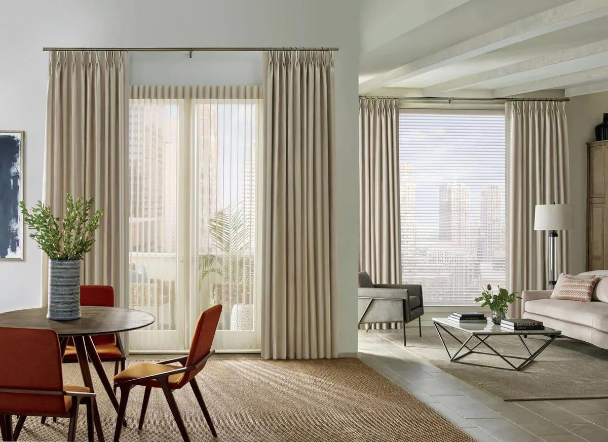 Modern living room with beige drapes and side panels