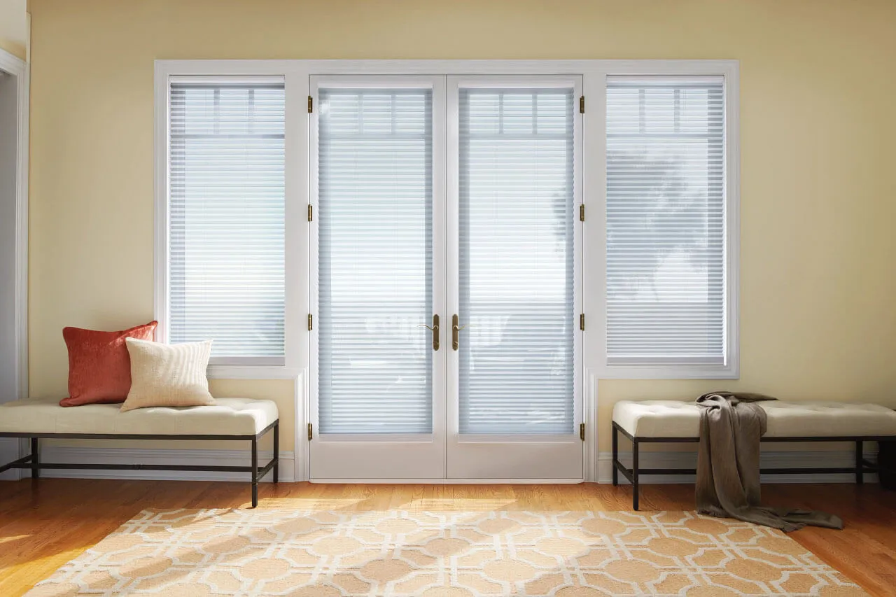 French doors with cellular shades and side benches.
