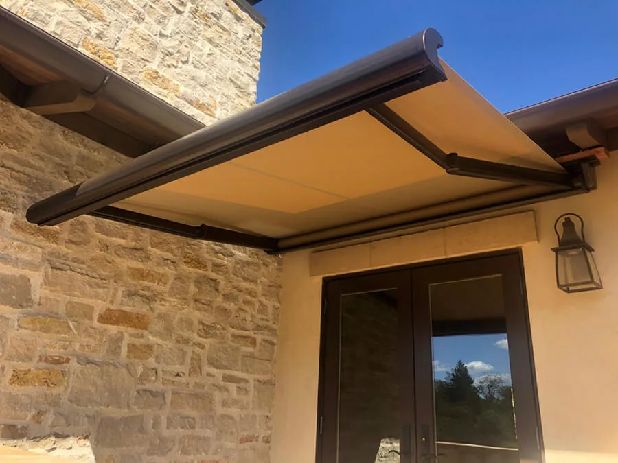 Retractable patio awning above glass doors.