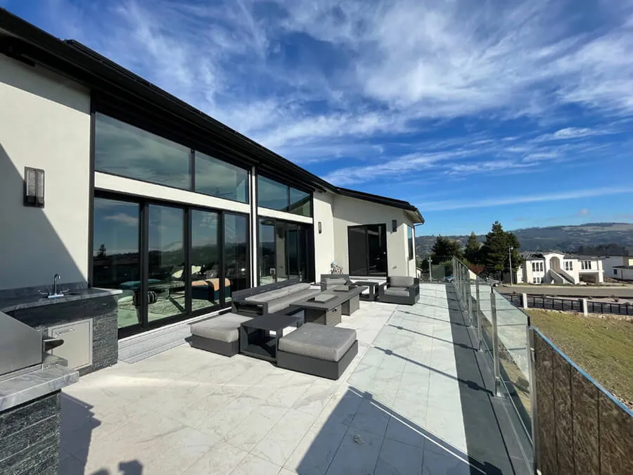 Patio with glass railing and retractable awning in Santa Rosa, California.