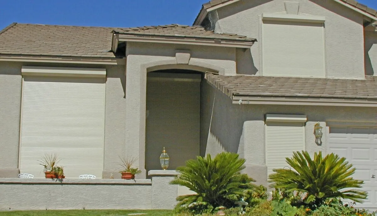 House with exterior rolling shutters.