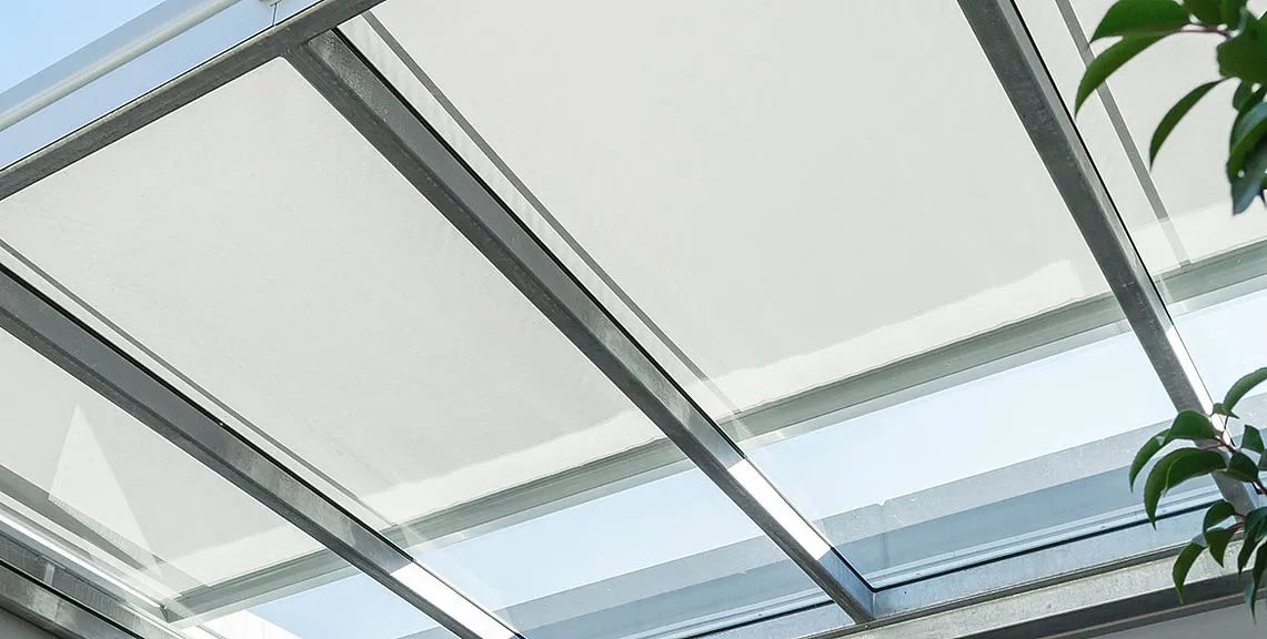 Skylight with white blinds.