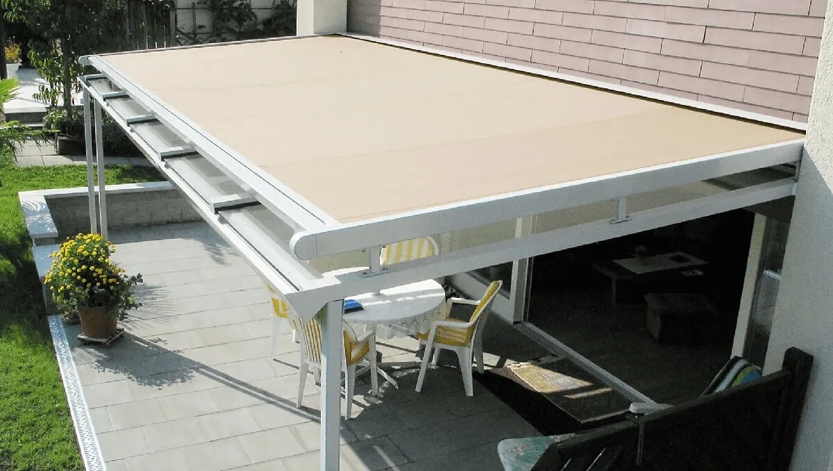 Patio with beige retractable skylight cover.