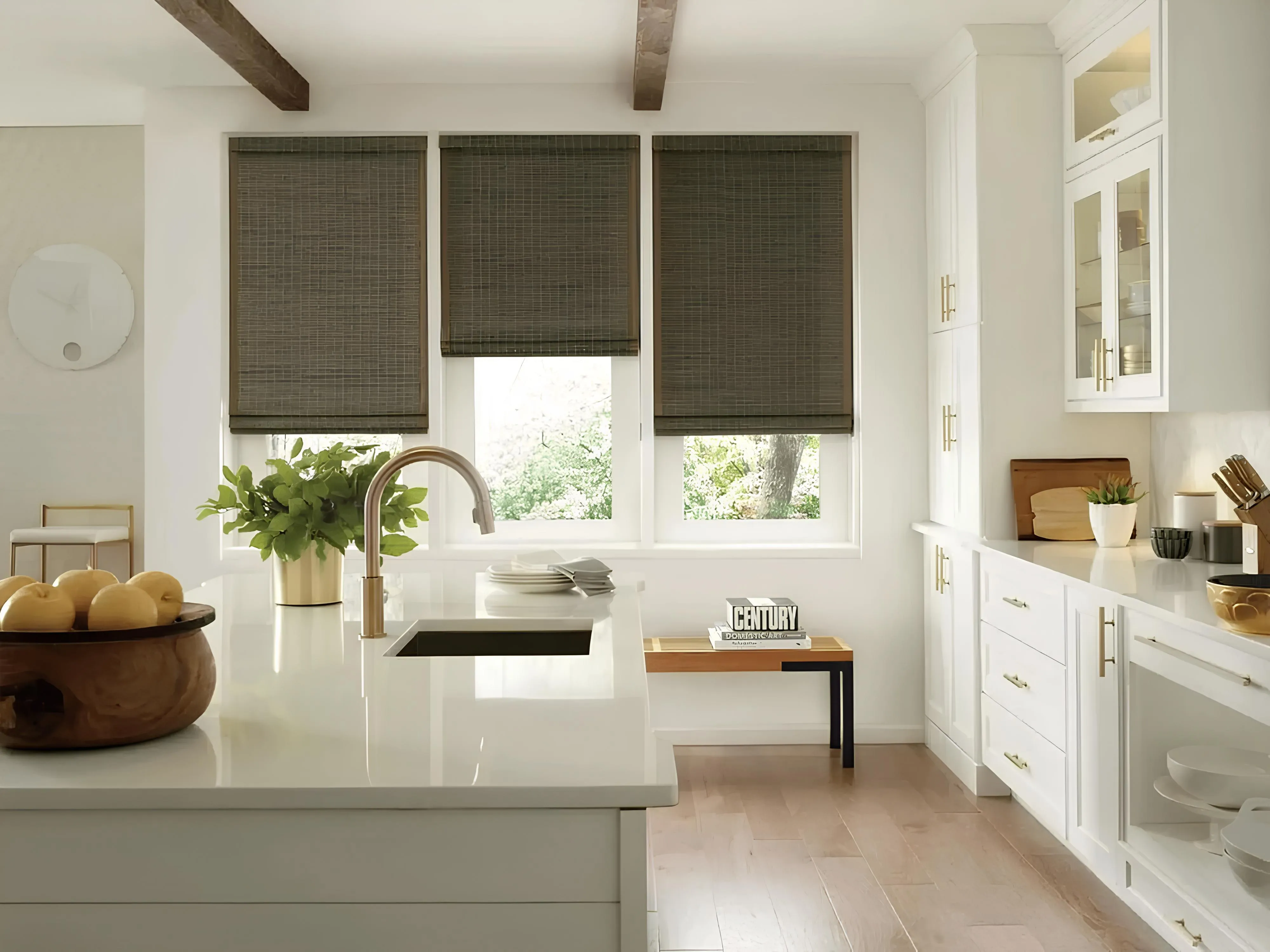 Kitchen with woven wood shades on windows.