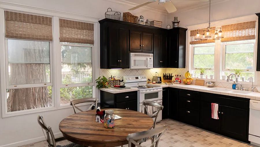 Kitchen with woven wood shades.