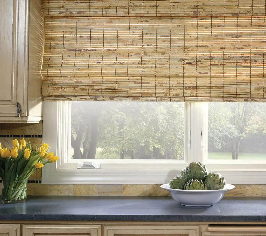 Woven wood shades on kitchen window.