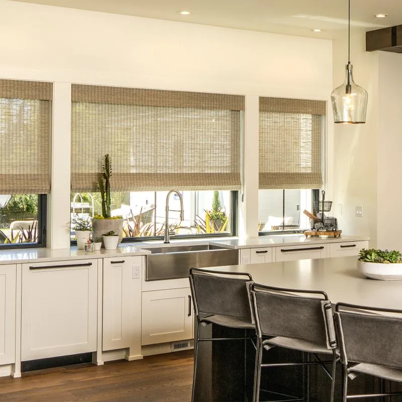Kitchen with woven wood shades