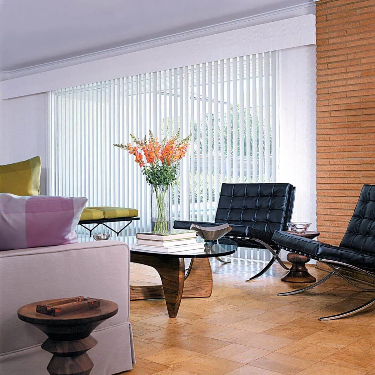 Vertical blinds on sliding glass door in modern living room.