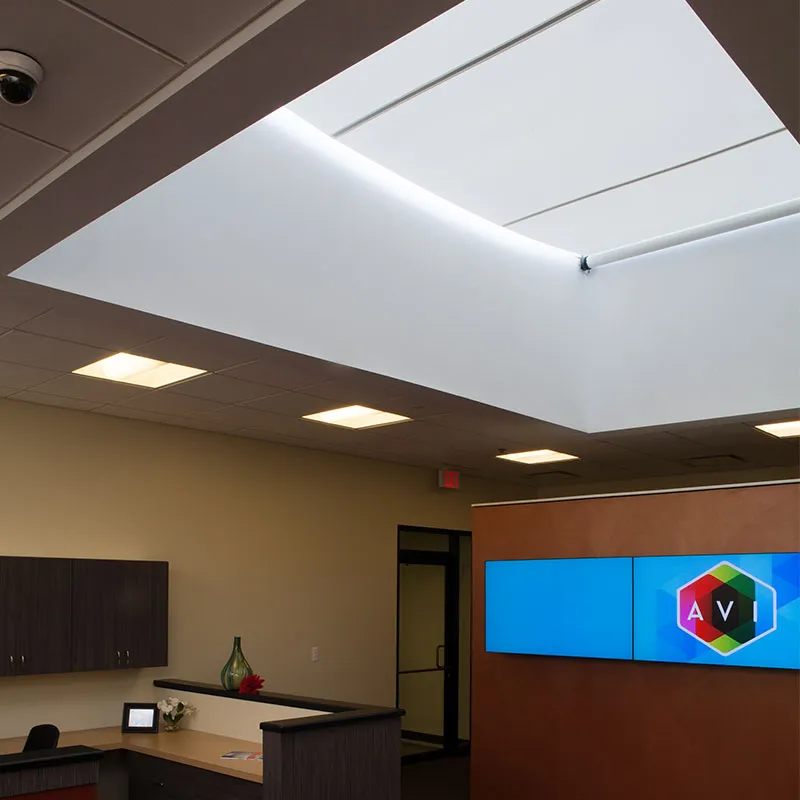 Office skylight with shades partially closed.