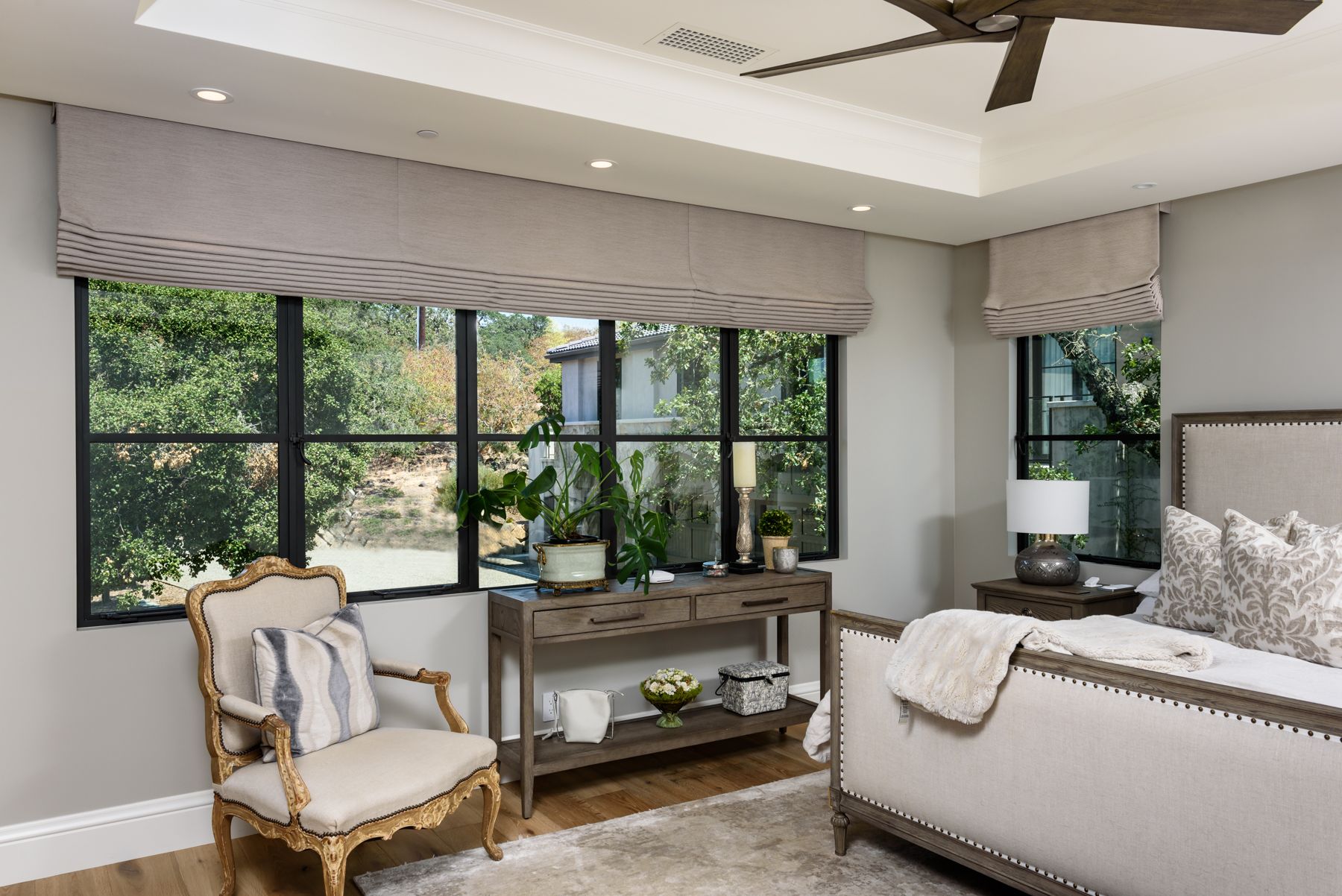 Bedroom with gray Roman shades