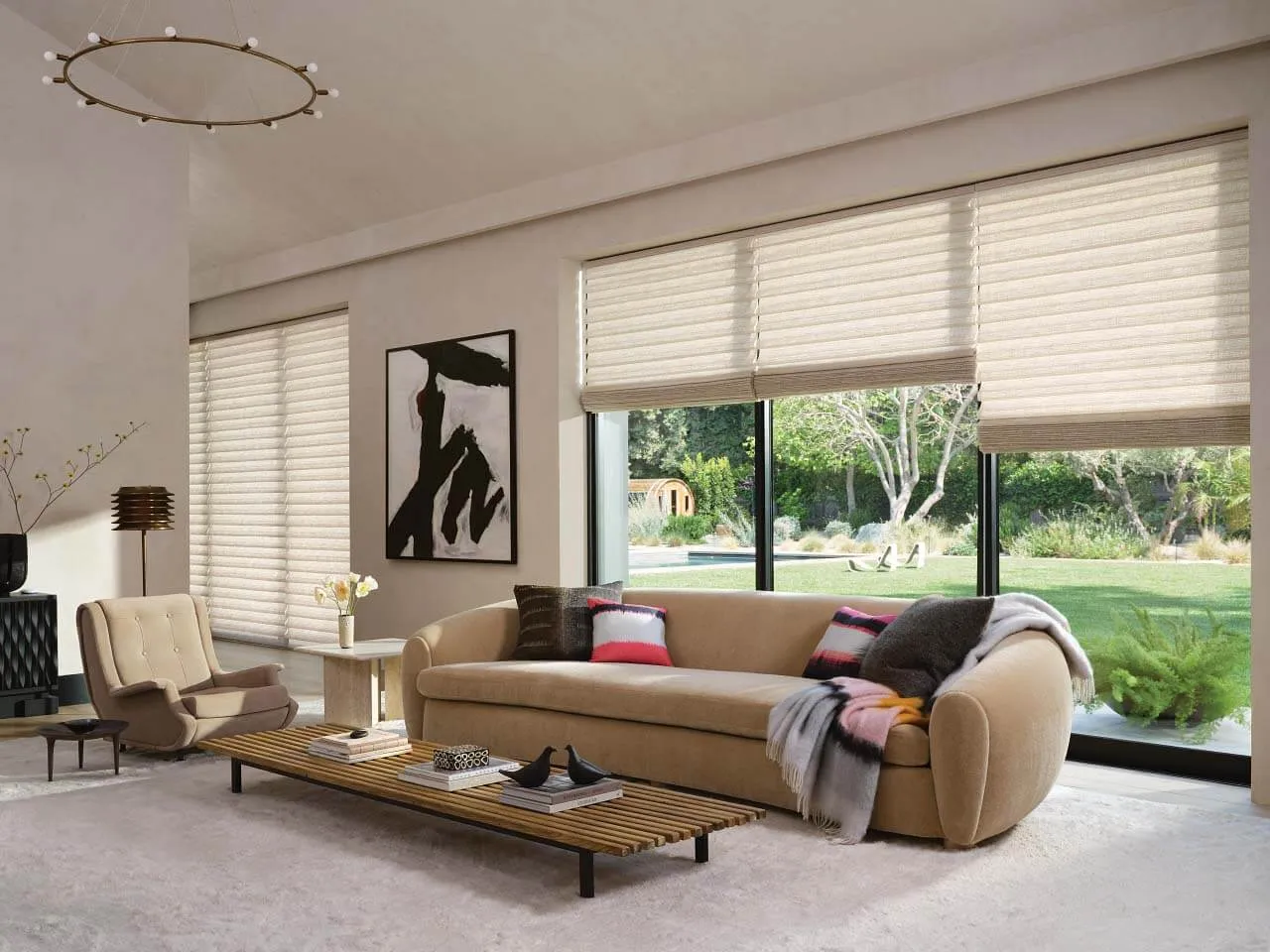 Living room with beige Roman shades.