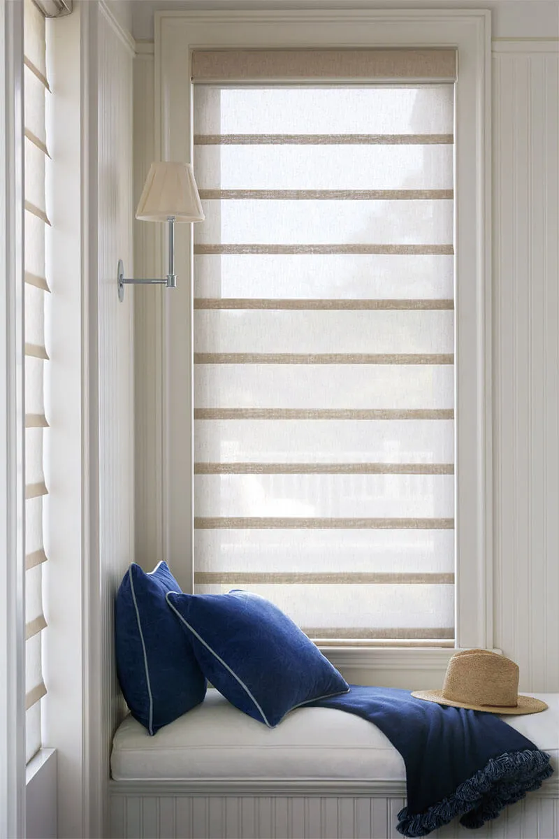 Roman shades in cozy window nook.