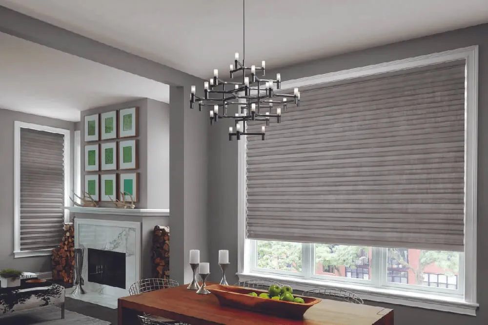 Dining room with gray Roman shades