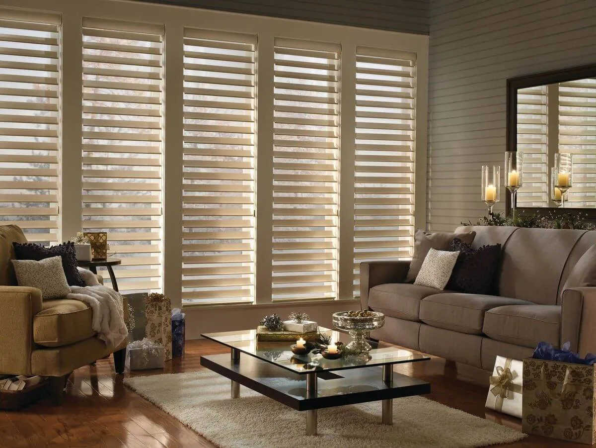 Modern living room with silhouette window shades filtering soft natural light.